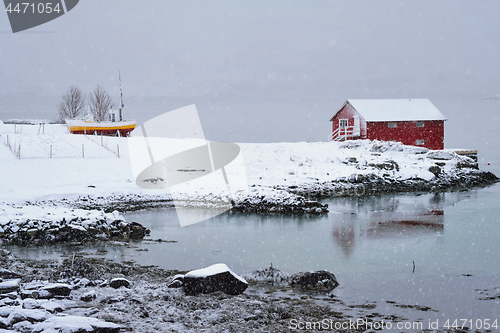 Image of Red rorbu house in winter, Lofoten islands, Norway