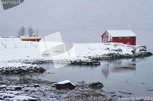 Image of Red rorbu house in winter, Lofoten islands, Norway