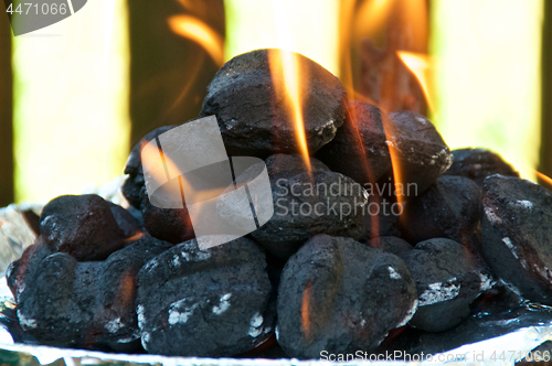 Image of Eye level Flaming BBQ briquettes 