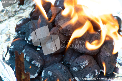 Image of Flaming BBQ briquettes 