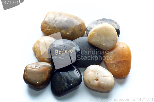 Image of polished stones with believe rock