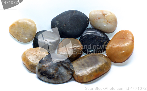 Image of group of polished stones over white