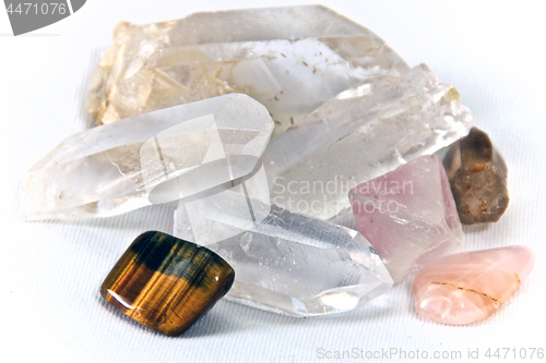 Image of quartz and cats eye stone on white