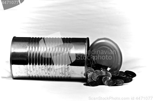 Image of large tin can with pennies on white