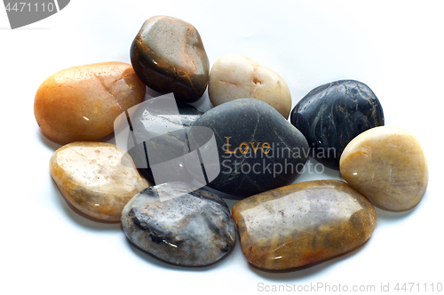 Image of polished stones with love rock