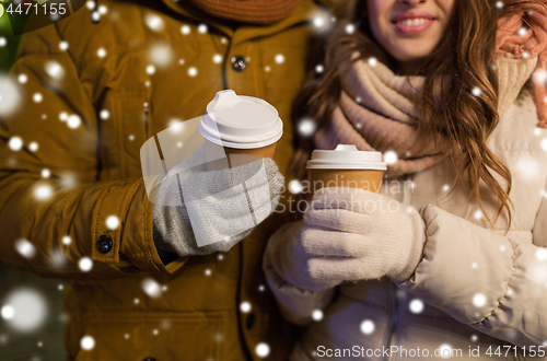 Image of close up of happy couple with coffee at christmas