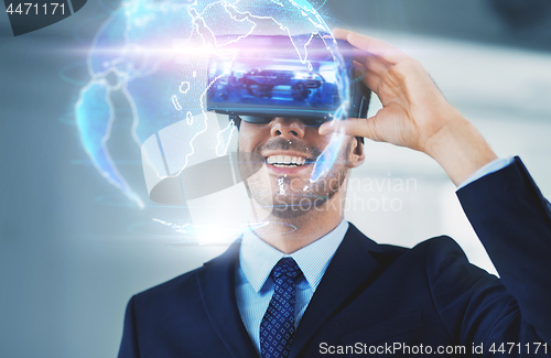 Image of businessman with virtual reality headset at office