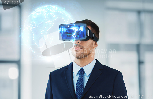 Image of businessman with virtual reality headset at office