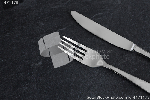 Image of close up of fork and knife on table