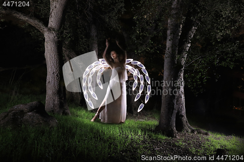 Image of Girl Light Painted in the Desert Under the Night Sky