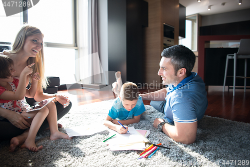 Image of young couple spending time with kids