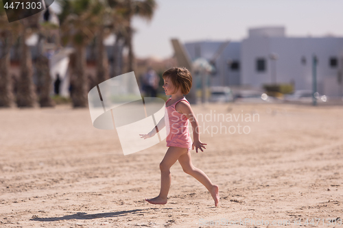 Image of little cute girl at beach
