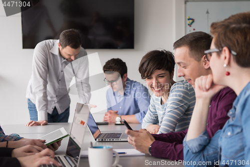 Image of Group of young people meeting in startup office