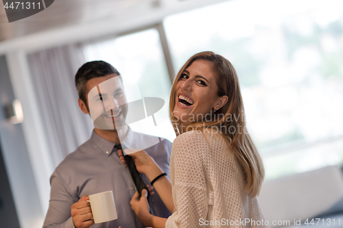 Image of A young couple is preparing for a job and using a laptop