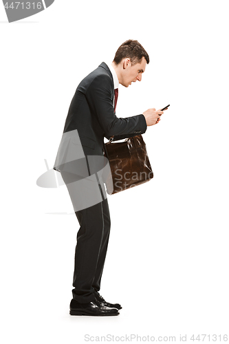 Image of Full body portrait of businessman with briefcase on white