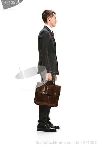 Image of Full body portrait of businessman with folder on white