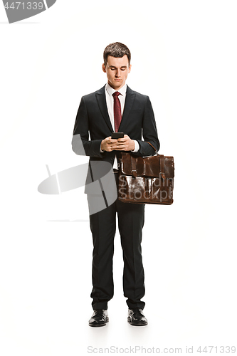 Image of Full body portrait of businessman with briefcase on white