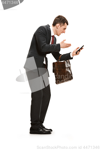 Image of Full body portrait of businessman with briefcase on white