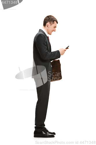 Image of Full body portrait of businessman with briefcase on white