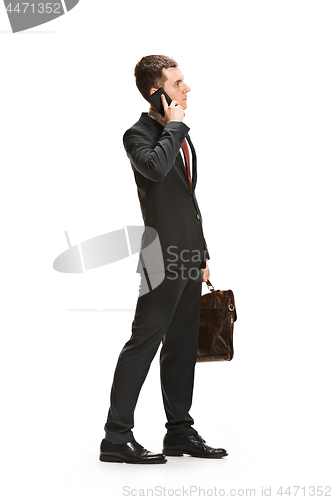 Image of Full body portrait of businessman with briefcase on white