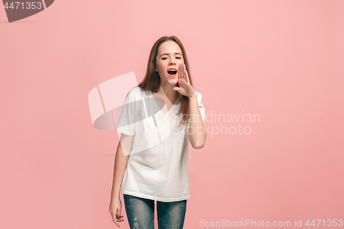 Image of young casual teen girl shouting at studio