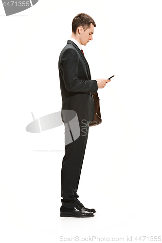 Image of Full body portrait of businessman with briefcase on white