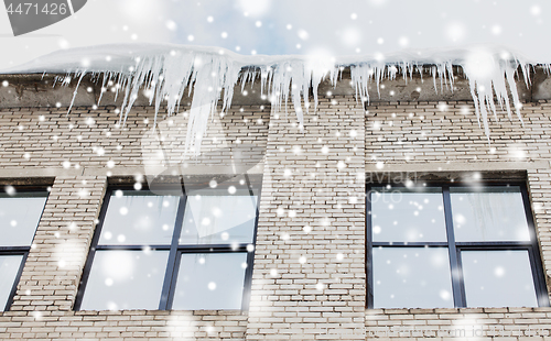 Image of icicles on building or living house facade