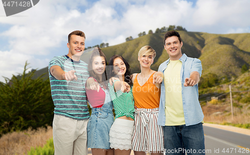 Image of friends pointing at you over big sur hills