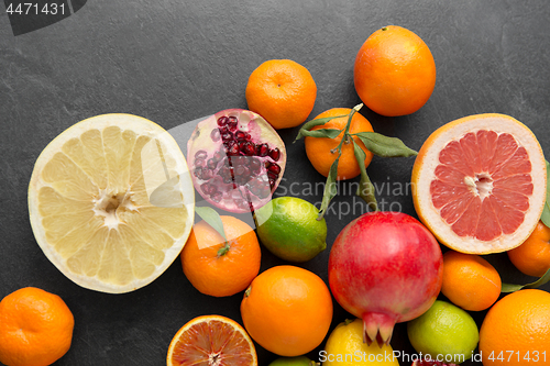 Image of close up of citrus fruits on stone table