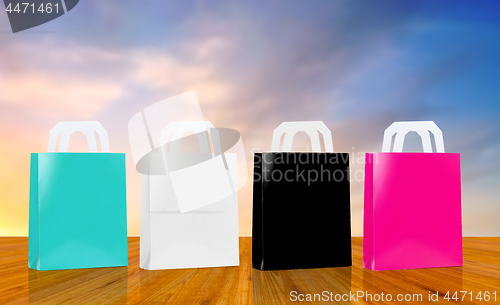 Image of many shopping bags over sky background