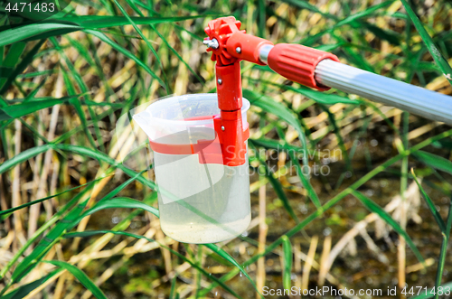 Image of Take samples of water for laboratory testing. The concept - anal