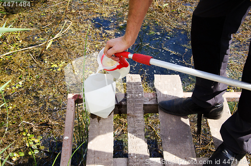 Image of Take samples of water for laboratory testing. The concept - anal