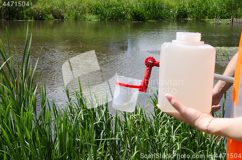 Image of Take samples of water for laboratory testing. The concept - anal