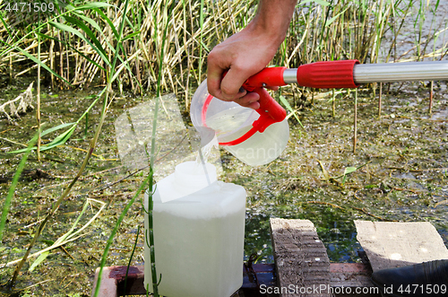 Image of Take samples of water for laboratory testing. The concept - anal