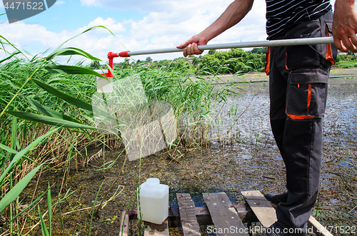 Image of Take samples of water for laboratory testing. The concept - anal