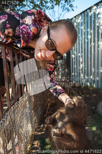 Image of Young woman with beaver