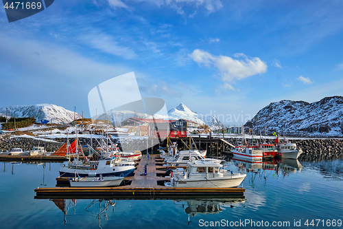 Image of Fishing boats and yachts on pier in Norway