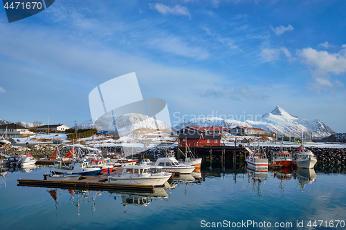 Image of Fishing boats and yachts on pier in Norway