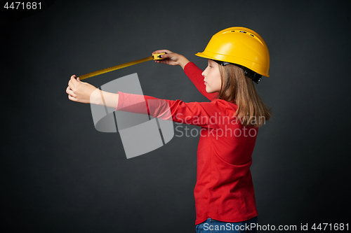 Image of Decoration, renovation and reconstrucion concept. Girl with measuring tape