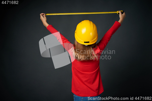 Image of Decoration, renovation and reconstrucion concept. Girl with measuring tape