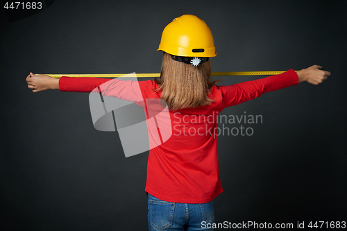 Image of Decoration, renovation and reconstrucion concept. Girl with measuring tape