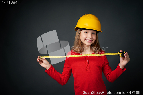 Image of Decoration, renovation and reconstrucion concept. Girl with measuring tape