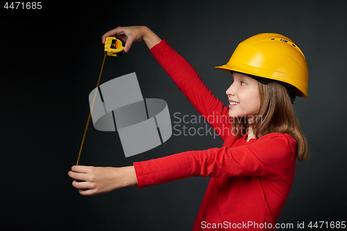 Image of Decoration, renovation and reconstrucion concept. Girl with measuring tape