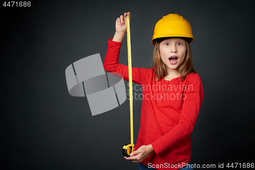 Image of Decoration, renovation and reconstrucion concept. Girl with measuring tape
