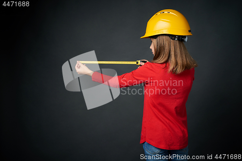 Image of Decoration, renovation and reconstrucion concept. Girl with measuring tape