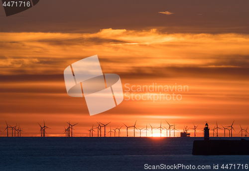 Image of Rampion Windfarm and Newhaven Lighthouse at Sunset