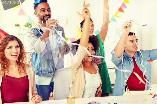 Image of happy team having fun at office party