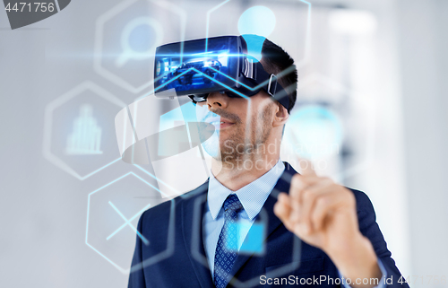 Image of businessman with virtual reality headset at office