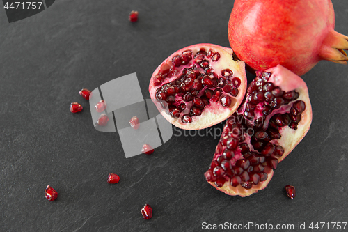 Image of close up of pomegranate on stone table