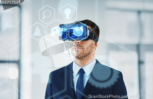 Image of businessman with virtual reality headset at office